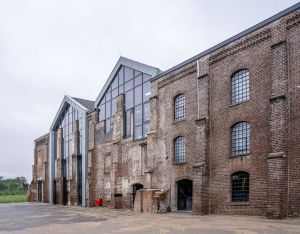 A vintage brick warehouse transformed with a contemporary glass facade.