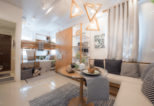Modern living room featuring bunk beds, stylish decor, and warm lighting.