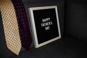 Celebrate Father's Day with a cozy setup featuring ties and a heartfelt message.